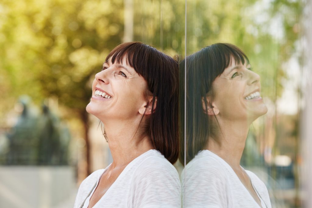 Woman looking up at the sky. 