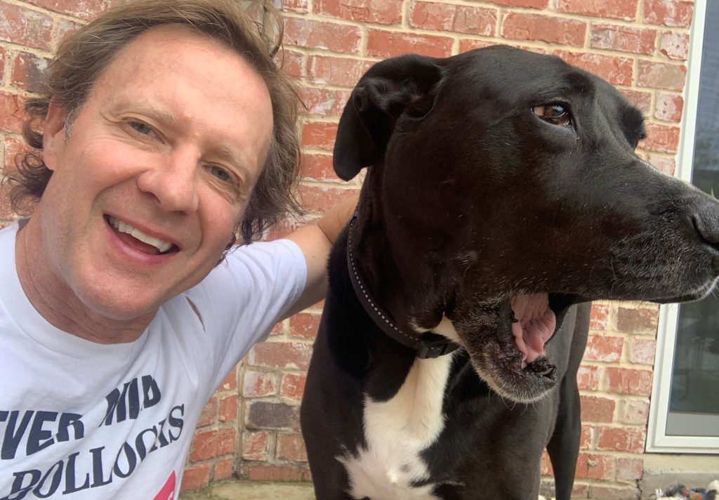 Dr. Kenkel and his dog, Mickey sheltering at home