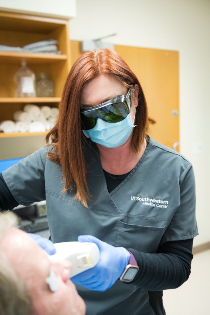 Dr. Kenkel's Aesthetician performs a laser procedure