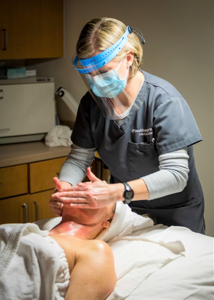 Dr. Kenkel's Aesthetician administers a chemical peel . 